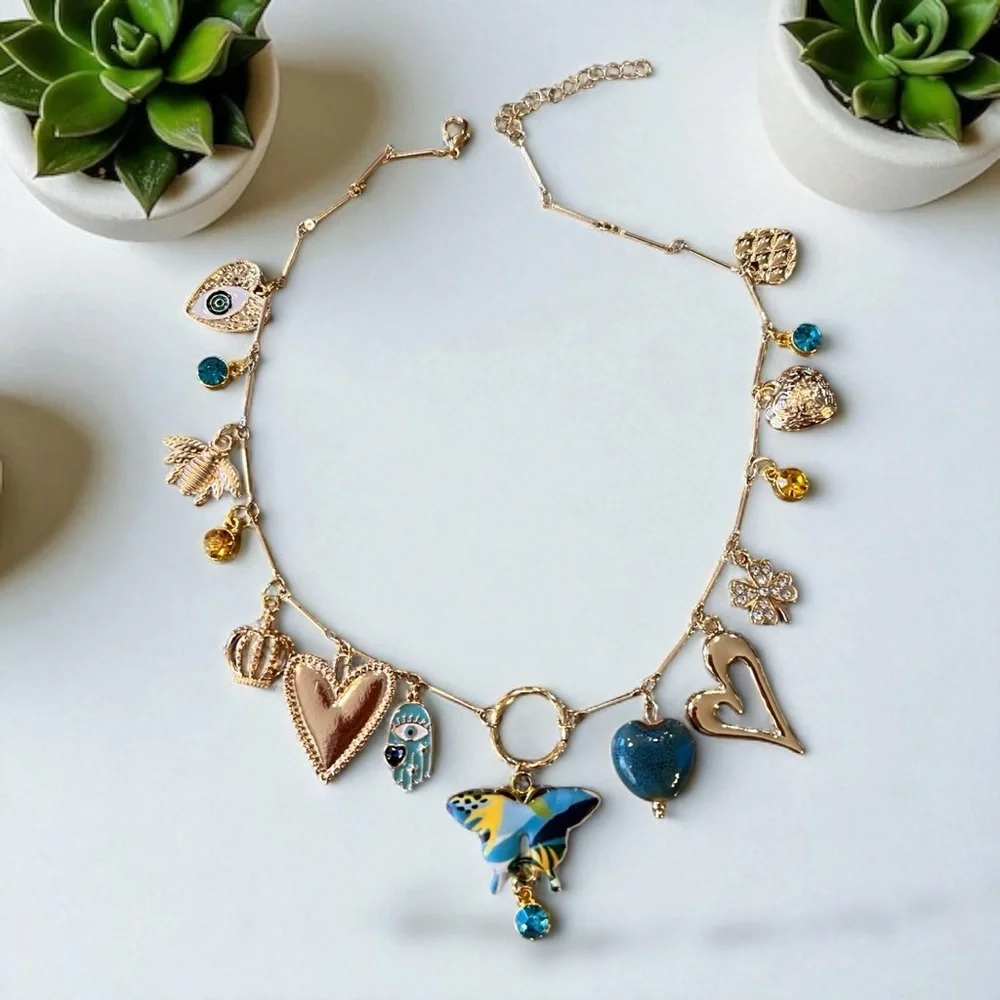 Unique and Gorgeous Gold toned Necklace with Varying Blue and Yellow Charms